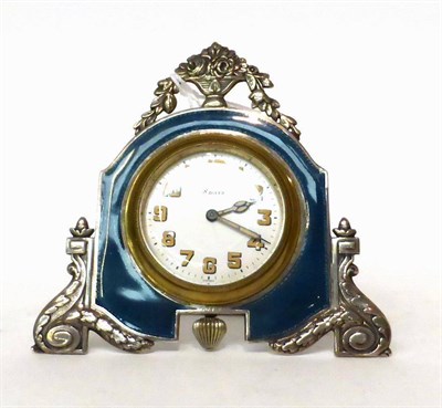 Lot 174 - * A enamel 8-day strut timepiece, circa 1930, surmounted by an urn of flowers, guilloche enamel...