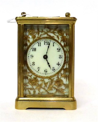 Lot 178 - * A brass carriage timepiece, circa 1910, carrying handle, enamel dial with Arabic numerals and...