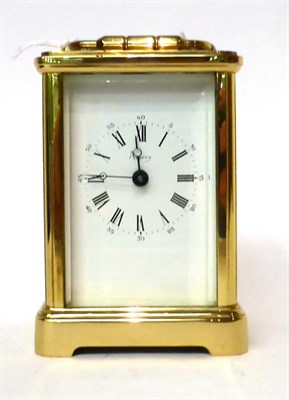 Lot 184 - * A brass carriage timepiece, retailed by Asprey, 20th century, carrying handle, white dial...