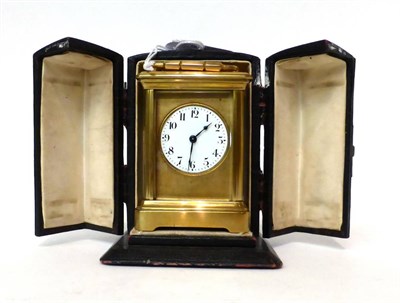 Lot 187 - * A small brass carriage timepiece, circa 1900, carrying handle, enamel dial with Arabic...