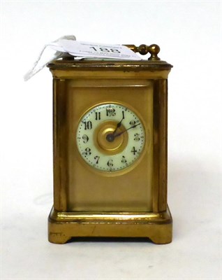 Lot 188 - * A small brass carriage timepiece, circa 1900, carrying handle, enamel Arabic chapter ring, single