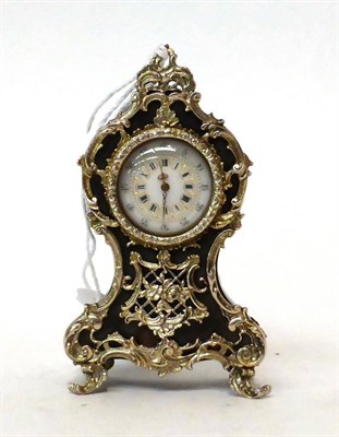 Lot 189 - * A miniature tortoiseshell and white metal mounted timepiece, 20th century, white metal scroll...