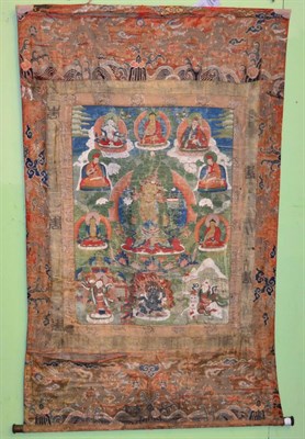 Lot 229 - A Sino-Tibetan Thangka, 18th/19th Century, distemper on cotton, the image 67cm by 46cm