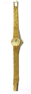 Lot 242 - A lady's 9ct gold wristwatch, signed Tissot, model: Stylist, 1969, lever movement, silvered...