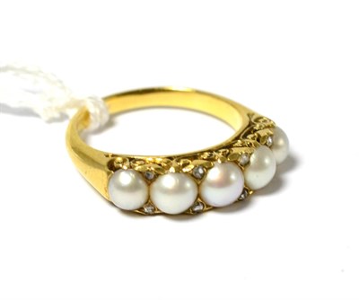 Lot 243 - A Victorian pearl and diamond ring, five split pearls with pairs of rose cut diamond accents...