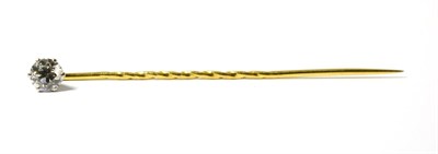 Lot 244 - A diamond set tie pin, an old cut diamond in a white claw setting on a yellow pin with a midway...