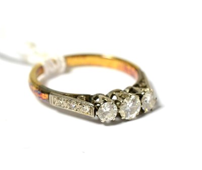 Lot 249 - A diamond three stone ring, three round brilliant cut diamonds in white claw settings, with diamond