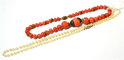 Lot 252 - A coral bead necklace, the graduated coral beads with green hardstone spacers, length 43.5cm...