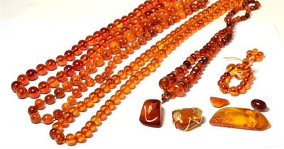 Lot 267 - Three amber necklaces, an amber necklace with pendant, two amber brooches, beads (some a.f.)