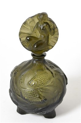 Lot 295 - A Czecholovakian Schlevogt smoky glass perfume bottle and stopper, moulded in relief with...