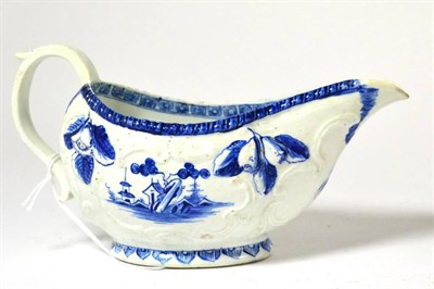 Lot 312 - A Derby porcelain sauceboat, circa 1760, of oval form moulded with flowersprays and scrolls,...