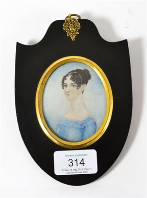 Lot 314 - A Georgian miniature portrait of a lady in black shield shape frame (Ann Thompson, 19 years, 1813)