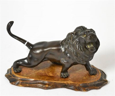 Lot 329 - A Japanese bronze figure of a lion, Meiji period, character mark to underside