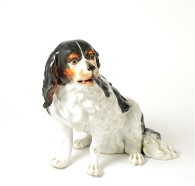 Lot 348 - A 19th century Continental figure of a seated dog, 21cm high