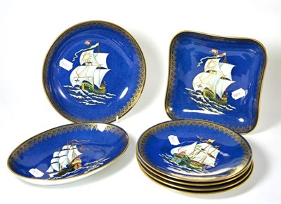 Lot 350 - A Wedgwood powder blue ground seven piece dessert service decorated with galleons