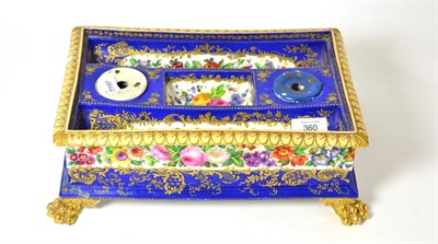 Lot 360 - A mid 19th century Paris porcelain rectangular inkstand, decorated with flowers on a blue ground