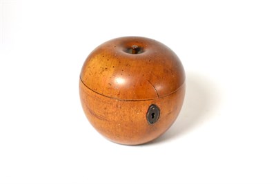 Lot 370 - A fruitwood tea caddy in the form of an apple, 11cm high