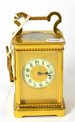 Lot 371 - A brass striking carriage clock, circa 1900, carrying handle, enamel Arabic chapter ring, twin...