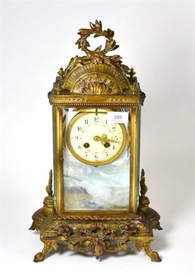 Lot 395 - A gilt metal four glass striking mantel clock, circa 1900, scroll and acanthus leaf mounts,...