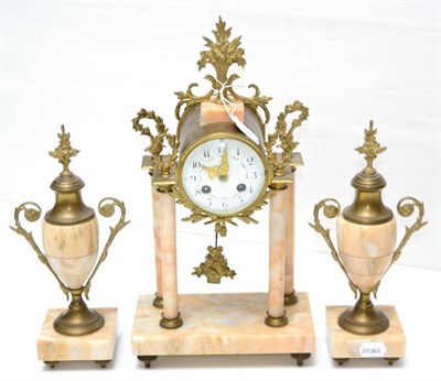 Lot 396 - A marble and gilt metal striking mantel clock garniture, early 20th century, four columns raised on