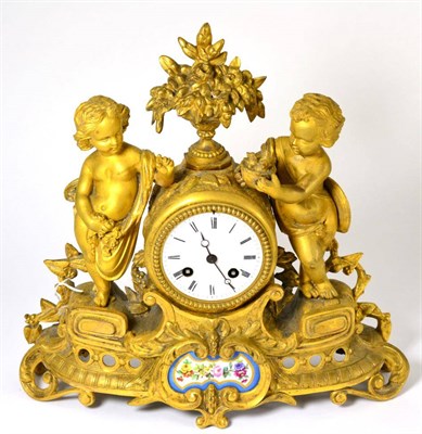 Lot 400 - An ormolu and porcelain mounted striking mantel clock, circa 1890, floral urn flanked by two...