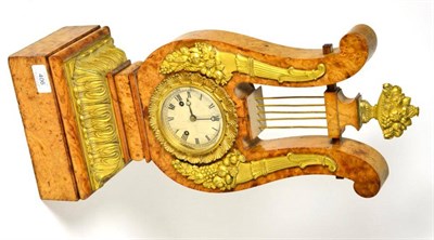 Lot 406 - An ormolu mounted striking lyre clock, 19th century, lyre shaped case with floral and acanthus leaf