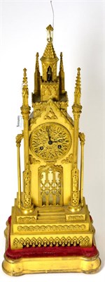 Lot 408 - A gilt metal striking Cathedral form mantel clock, circa 1850, surmounted by a concealed bell,...