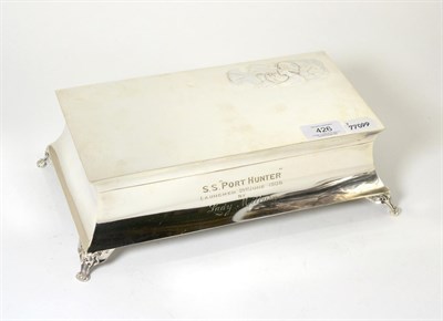 Lot 426 - A silver jewellery box of rectangular form, with worn silk interior raised on four claw feet,...