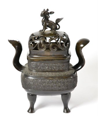 Lot 445 - # A Chinese bronze incense burn and cover, the pierced cover surmounted by a dog of fo, the...