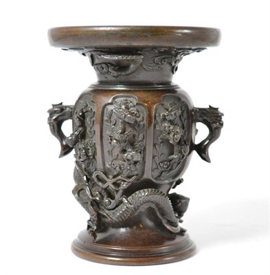 Lot 446 - # A Meiji period Japanese bronze vase, with twin-handles the body cast with phoenix, dragon and...