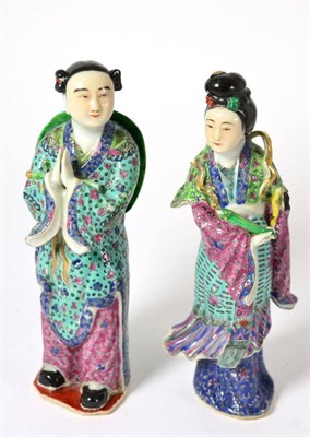 Lot 447 - A pair of Chinese porcelain figures of a man and woman with famille rose decoration, 19.5cm high