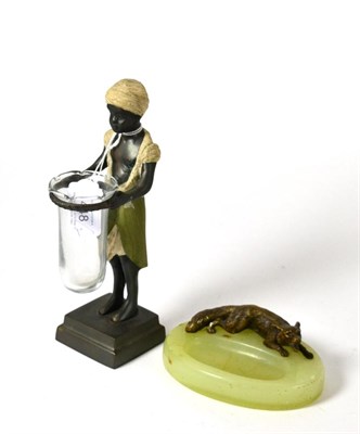 Lot 448 - ^ A bronze figure of a blackamoor holding glass posy holder, 21cm; and an onyx ashtray with...