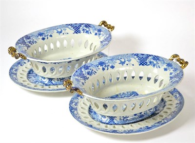 Lot 450 - ^ A pair of Davenport Stone China twin-handled chestnut baskets and stands, printed in...