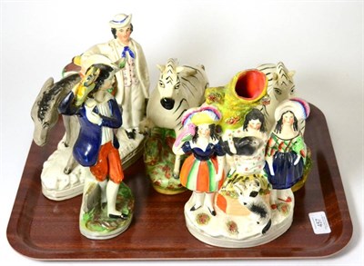 Lot 457 - ^ A Staffordshire pottery figure of Beesuns, 21cm; a pair of zebras; a spill vase group; and a...