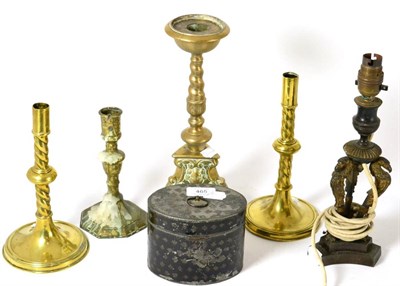 Lot 465 - A pewter tobacco box, four various brass candlesticks and a bronze table lamp