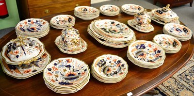 Lot 470 - A Ridgway porcelain dinner service, circa 1830, painted in Imari colours with a jardinière of...