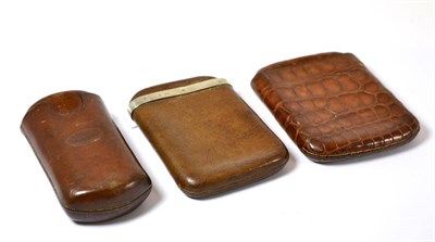 Lot 480 - Three 19th century leather cigar cases, one stamped I & E Butler, registered May 22nd 1844