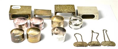 Lot 486 - Four silver matchboxes cases, seven silver napkin rings and three silver decanter labels