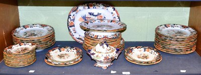 Lot 512 - A mid-19th century ironstone dinner service comprising dinner plates, tea-plates, ham dish,...