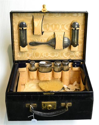 Lot 513 - A leather cased travel set, with cut glass bottles and silver mounts, the lid stamped B.D.S...