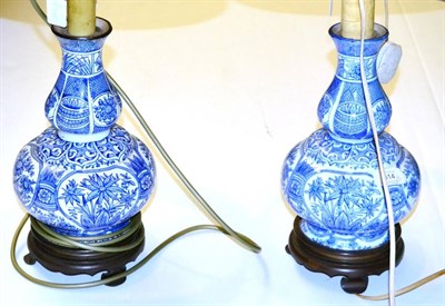 Lot 514 - ^ A near pair of blue and white faience double gourd vases as lamp bases, 30cm high