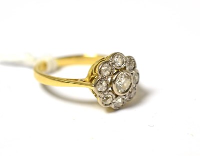 Lot 533 - A diamond cluster ring, the old cut and eight cut diamonds in white collet settings to a yellow...