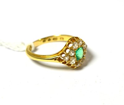 Lot 535 - An 18ct gold emerald and diamond cluster ring, the square step cut emerald within a border of...