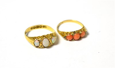 Lot 550 - A 19th century coral ring, the three cabochon coral spaced by rose cut diamond accents, finger size