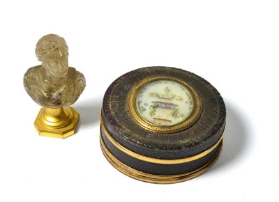 Lot 557 - ^ An early 19th century gilt metal mounted tortoiseshell circular snuff box and cover set with...