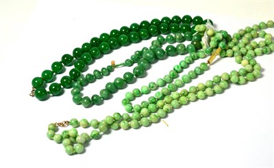 Lot 573 - Four green hardstone necklaces, one possible aventurine quartz, two possible jade examples (4)