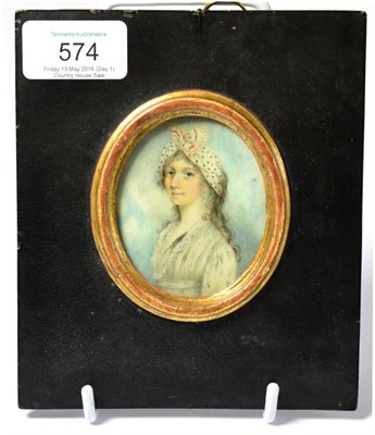 Lot 574 - A late George III oval portrait miniature on ivory, depicting a young woman wearing a silk...