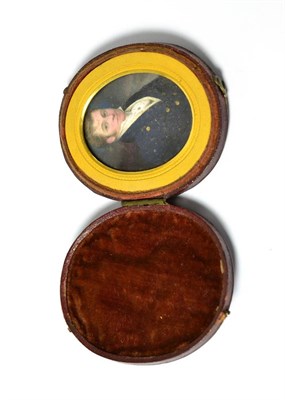 Lot 580 - An early 19th century Continental oval portrait miniature on ivory, depicting a gentleman, half...