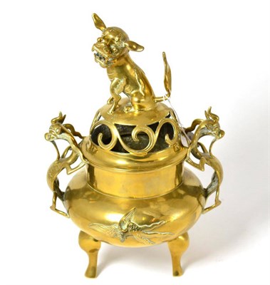 Lot 586 - # A Chinese bronze incense burner and stand, the twin handles cast as mythical creatures and with a