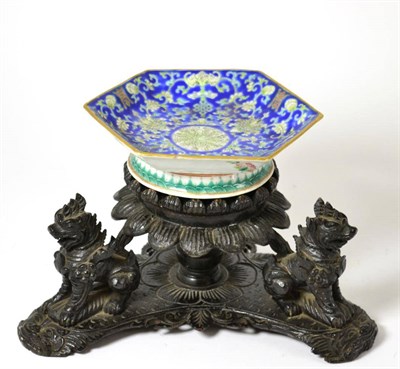 Lot 589 - # A Chinese hexagonal dish with floral decoration with a hardwood stand of tri form shape...